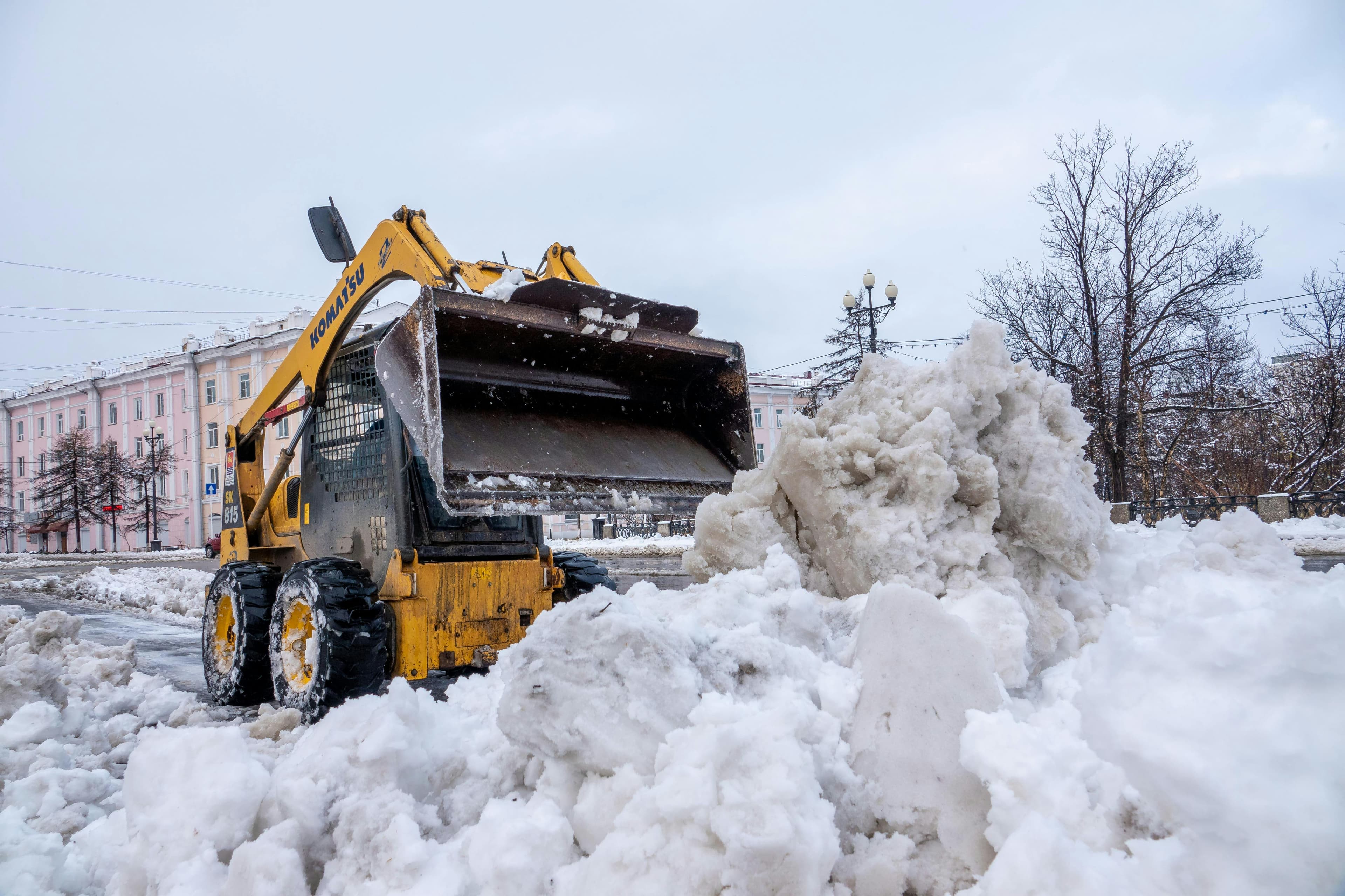 Bulldozer clearing snow off the street